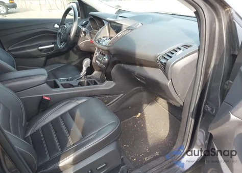 2017 Ford Escape Titanium z USA, uszkodzony, nr VIN 1FMCU0J94HUB95227